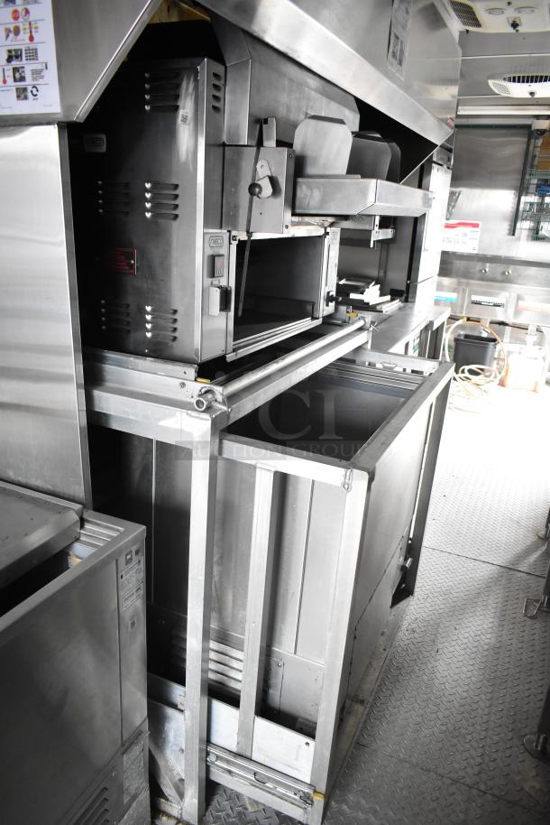 2021 Rock Solid Cargo 28' fast food trailer, features CaptiveAire hood, Nieco broiler, Frymaster fryer, True freezers.