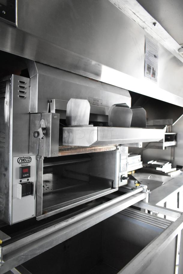 2021 Rock Solid Cargo 28' fast food trailer with Nieco broiler. Equipped for mobile kitchen use. Features commercial equipment.