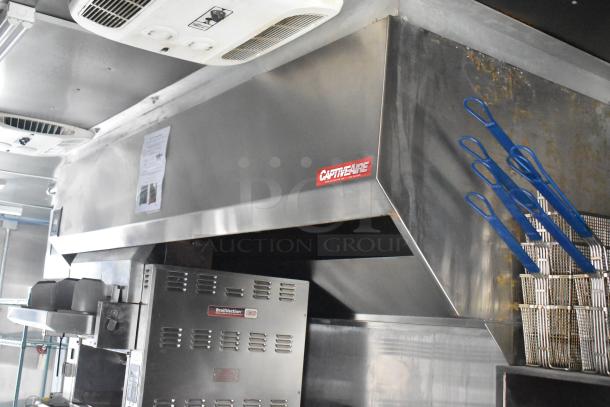 2021 Rock Solid Cargo fast food trailer interior with CaptiveAire grease hood, Nieco Broiler, and fry baskets.