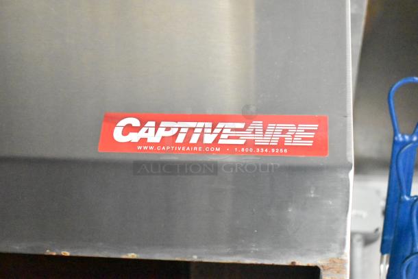 CaptiveAire grease hood label on 2021 Rock Solid Cargo 28' mobile kitchen trailer, fully equipped with commercial appliances.