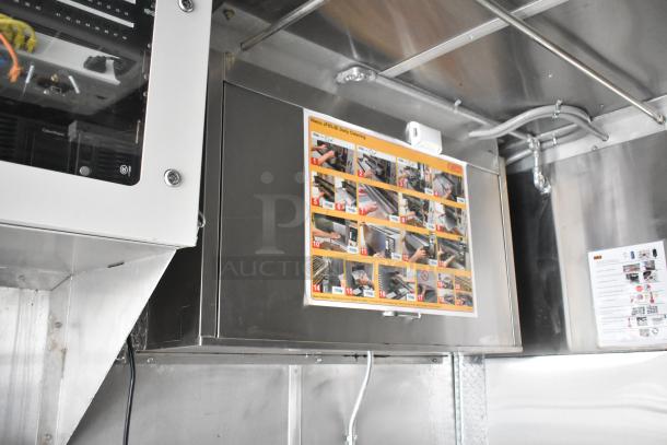 Interior of 2021 Rock Solid Cargo food trailer with equipment instructions and wiring visible.