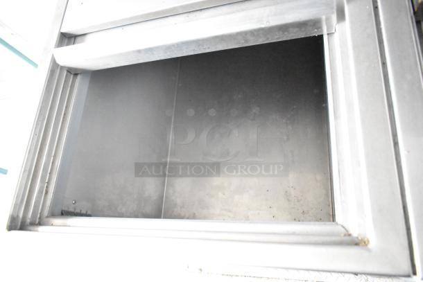 Interior of a 2021 Rock Solid Cargo fast food trailer showcasing clean metal surfaces and durable construction.