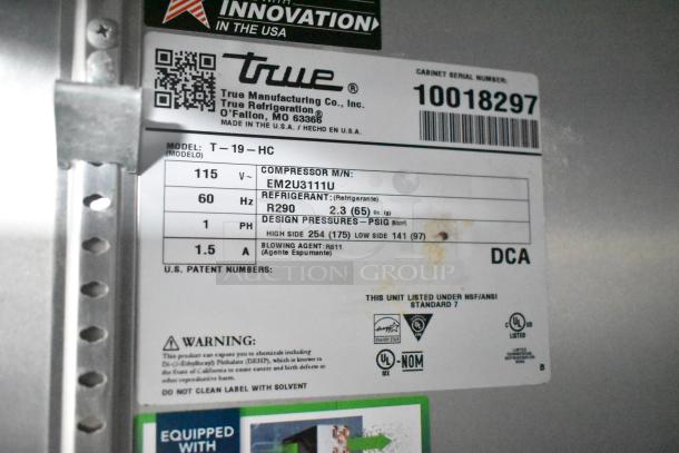 Label on a True Manufacturing refrigeration unit, model T-19-HC, showing electrical specs and refrigerant type R290.