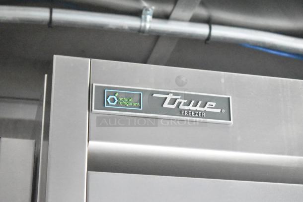 True brand freezer door with "natural refrigerant" label, part of a fully equipped commercial mobile kitchen setup.