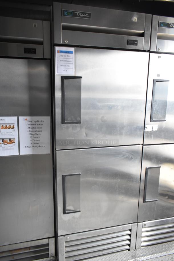 2021 Rock Solid Cargo 28' fast food trailer interior, featuring commercial-grade True freezers with labeled contents list.