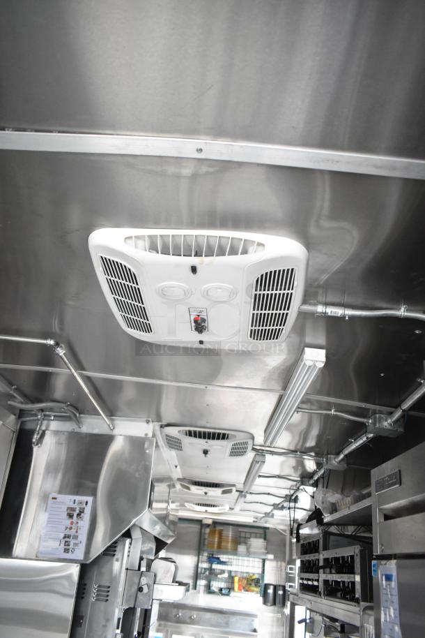 2021 Rock Solid Cargo 28' fast food trailer interior with commercial-grade equipment, including CaptiveAire hood and Nieco broiler.