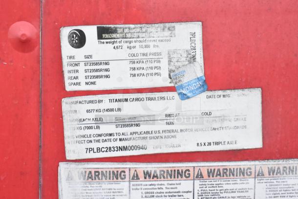 Label of 2021 Titanium Cargo 8.5' x 28' trailer. Shows tire size, pressure, GVWR 6577 kg, 3-axle info.