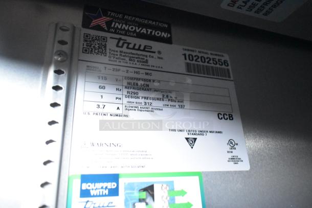 Label on True refrigerator model T-23F-2-HC-MC with specs: 115V, 60Hz, R290 refrigerant, NSF/ANSI Standard 7 compliant.