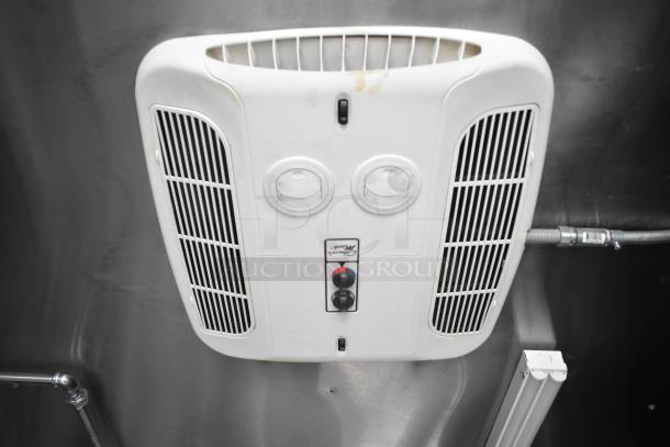 Interior view of 2021 Rock Solid Cargo food trailer's ventilation system. Features a white ceiling-mounted air vent, electrical wiring.