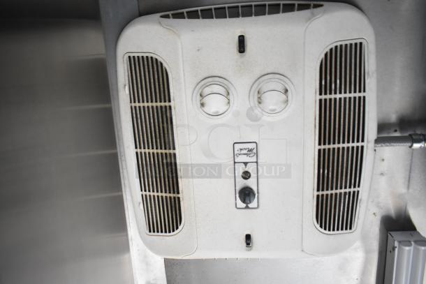 Ceiling-mounted air vent inside the 2021 Rock Solid Cargo fast food trailer, featuring adjustable dials and air vents.