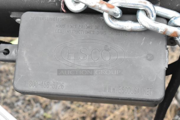 Black ESCO connector box with chain, engraved with logo and contact info: "1-800-456-3726," "www.escousa.net."