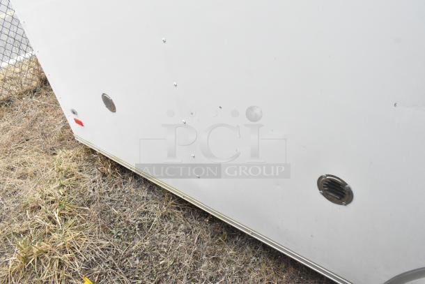 2020 ATX 8.5' x 24' white food trailer exterior, CaptiveAire hood, fire system, Arctic Air prep tables included, single axle.