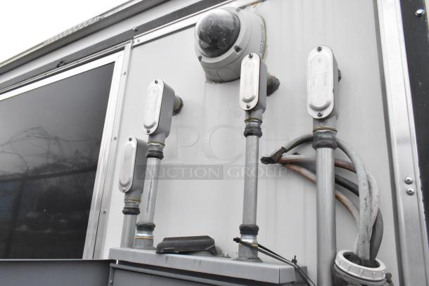 ATX 2020 cold food trailer exterior wiring and camera setup. Features CaptiveAire hood, Arctic Air appliances.