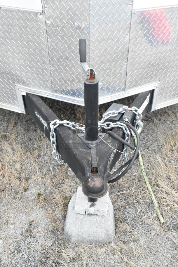 2020 ATX cold food trailer hitch, diamond plate siding, secured with a chain. Features a single axle setup.