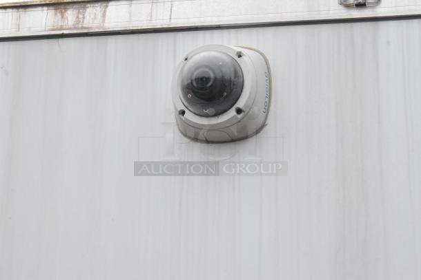 Outdoor surveillance camera installed on the side of a 2020 ATX cold food and beverage trailer.