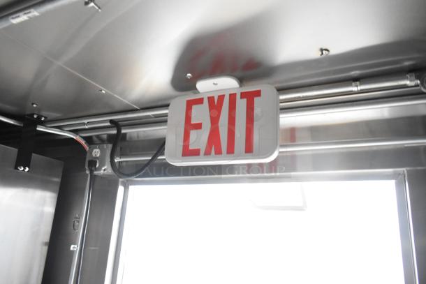 Interior view of 2020 ATX 8.5' x 24' food trailer showing ceiling-mounted EXIT sign.