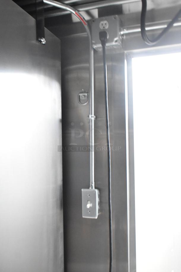 Interior view of 2020 ATX 8.5' x 24' trailer showing electrical conduit and outlets. Stainless steel wall finish.