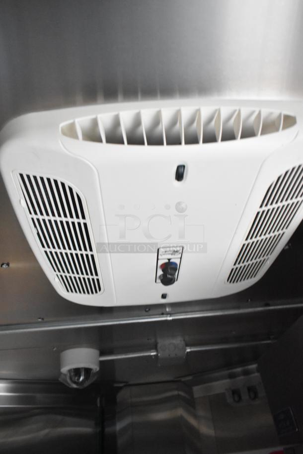 2020 ATX cold food trailer interior showing air conditioning vent and ceiling fixtures; equipped with CaptiveAire hood.