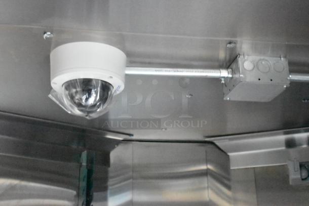 Interior view of 2020 ATX food trailer. Visible security camera, metal ceiling, and light fixtures. Clean, well-maintained condition.