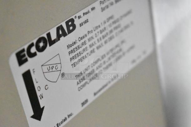 Close-up of an Ecolab label on the 2020 ATX food trailer, detailing pressure and temperature specs for Oasis Pro Ultra 1 cleaning unit.