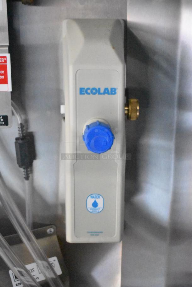 Ecolab water control device attached to the interior of a 2020 ATX Cold Food & Beverage Trailer. Clear labeling visible.
