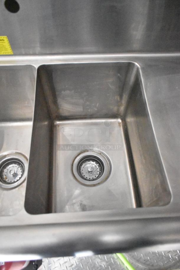 Stainless steel sink in 2020 ATX food trailer. Clean, dual-compartment design with drainage fittings. Suitable for food prep.