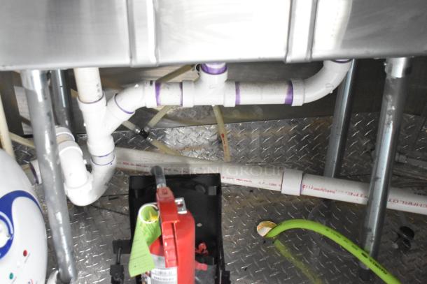 2020 ATX Cold Food Trailer plumbing and wiring details, showing pipes, hoses, and fire suppression components inside.