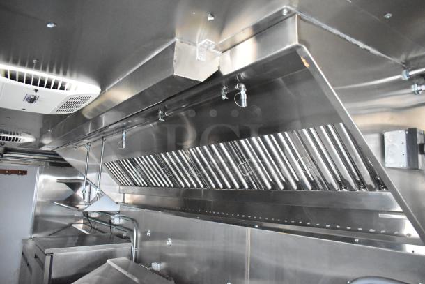 2020 ATX 8.5' x 24' trailer interior with CaptiveAire grease hood, fire suppression system, Arctic Air prep tables.