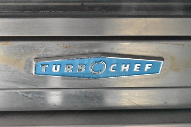TurboChef logo on stainless steel surface, part of the 2020 ATX 8.5' x 24' food trailer equipment.