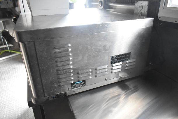 Stainless steel interior of 2020 ATX 8.5' x 24' food trailer showing Arctic Air equipment and ventilation slits.