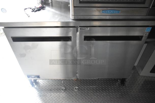 2020 ATX food trailer interior with Arctic Air prep tables and coolers, TurboChef unit, and diamond plate flooring.