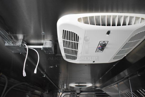 Interior view of a 2020 ATX 8.5' x 24' food trailer, showing ventilation and network cabling. Features include Arctic Air prep tables.