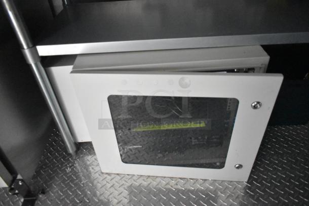 2020 ATX 8.5' x 24' trailer interior showing Martin IT/Network Cabinet on a diamond plate floor.