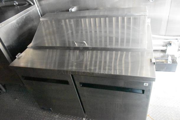 2020 ATX 8.5' x 24' cold food trailer interior, Arctic Air prep table with stainless steel finish, part of the food/beverage setup.