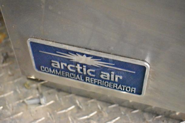 Arctic Air commercial refrigerator badge on the 2020 ATX 8.5' x 24' food trailer, indicating refrigeration brand.