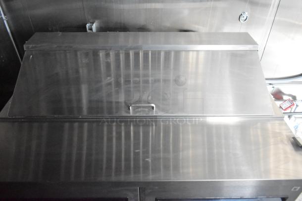 2020 ATX 8.5' x 24' trailer interior, showing a stainless steel Arctic Air prep table with a metal lid.
