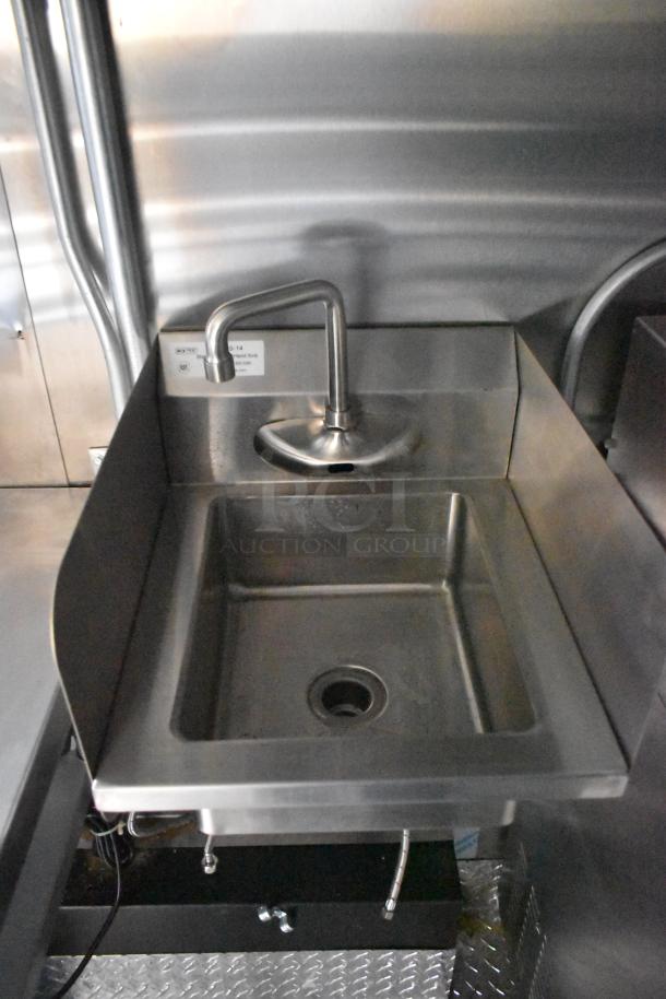 Stainless steel sink inside the 2020 ATX 8.5' x 24' food trailer, featuring a sleek faucet and drain, in excellent condition.