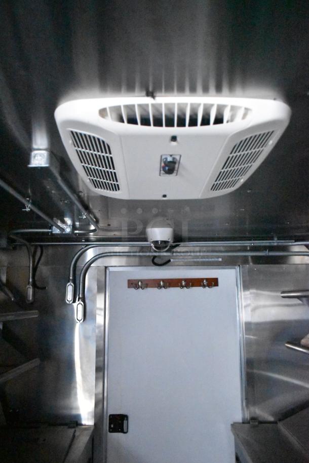 2020 ATX 8.5' x 24' food trailer interior showing CaptiveAire grease hood and ventilation setup.