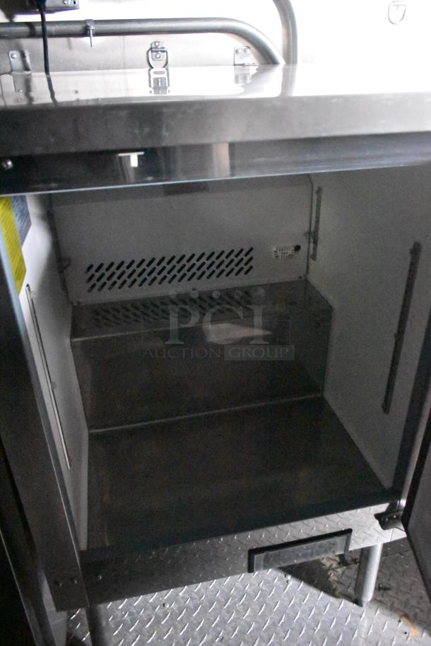 2020 ATX 8.5' x 24' food trailer interior, showing CaptiveAire grease hood, fire system, clean stainless surfaces, clear title.