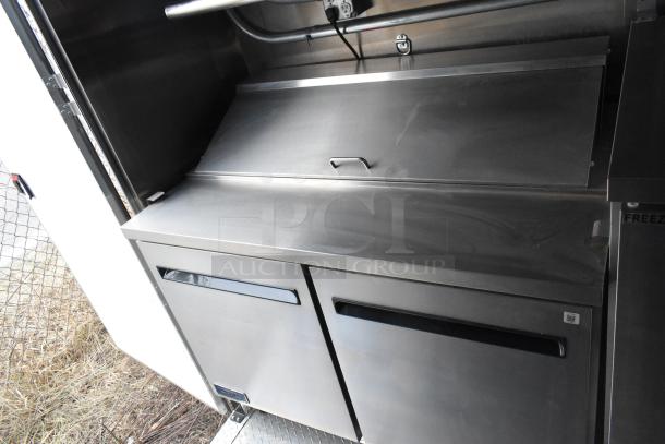 2020 ATX 8.5' x 24' trailer interior with Arctic Air prep table, stainless steel finish, excellent condition.