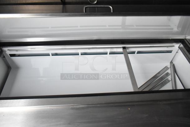 2020 ATX 8.5' x 24' trailer interior, featuring Arctic Air prep tables and coolers, stainless steel fixtures, excellent condition.