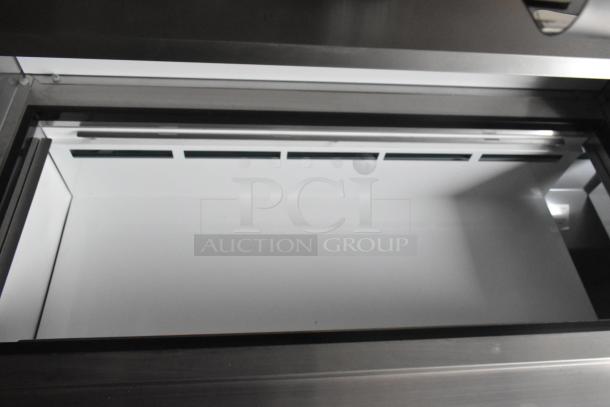 Interior of Arctic Air cooler in 2020 ATX 8.5' x 24' food trailer, highlighting clean, spacious compartment.