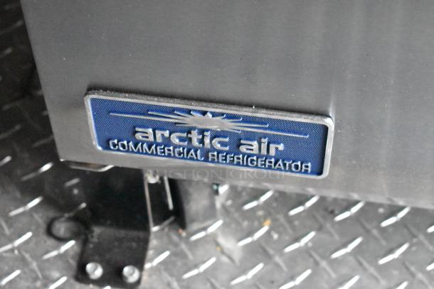 Arctic Air commercial refrigerator badge on diamond plate flooring, part of 2020 ATX cold food trailer equipment.
