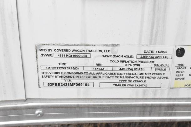 Trailer label showing manufacturer: Covered Wagon Trailers, LLC, GVWR: 4531 kg, 2020, VIN: 53FBE2428MF069104.