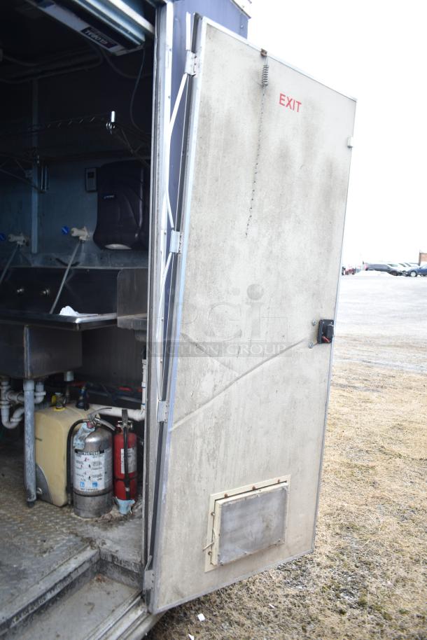 2019 Cruising Kitchens 8.5' x 24' trailer, open side view showing CaptiveAire grease hood, fire suppression system, and EXIT door.