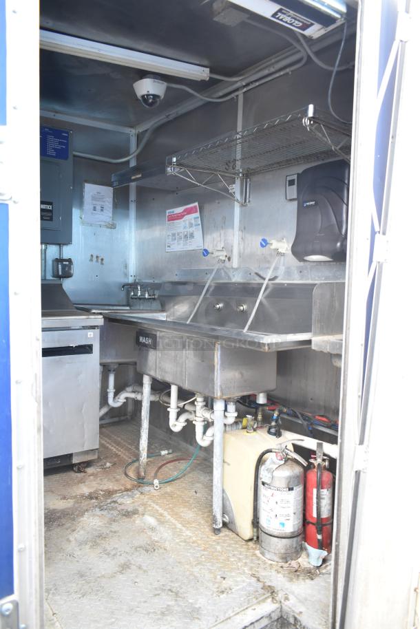 2019 Cruising Kitchens 8.5' x 24' cold food trailer interior with stainless sinks, grease hood, and fire suppression.