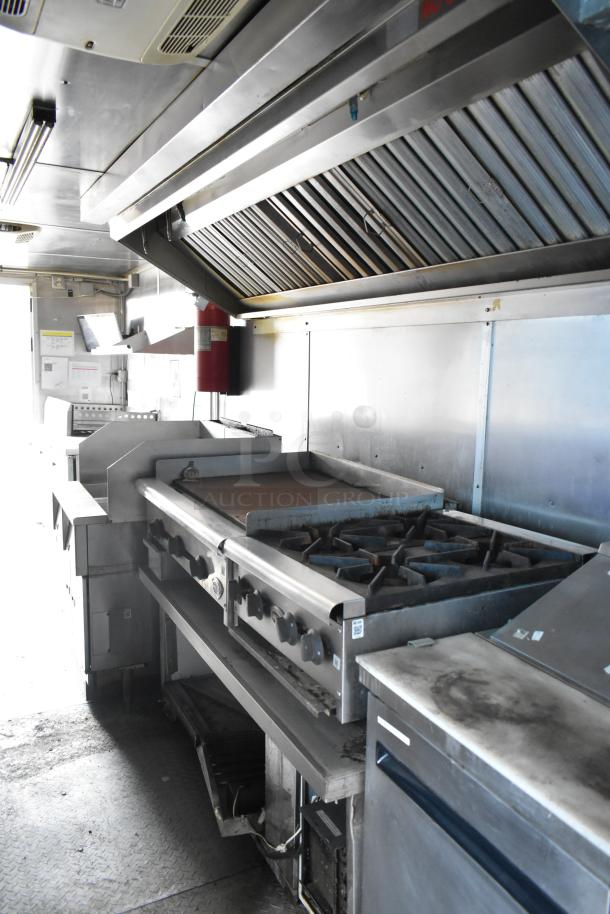 2019 Cruising Kitchens cold food trailer interior with CaptiveAire grease hood, Arctic Air appliances, and Martin IT cabinet.