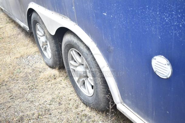 2019 Cruising Kitchens 8.5' x 24' cold food trailer with dual wheels, sold with clear title; exterior shows usage wear.