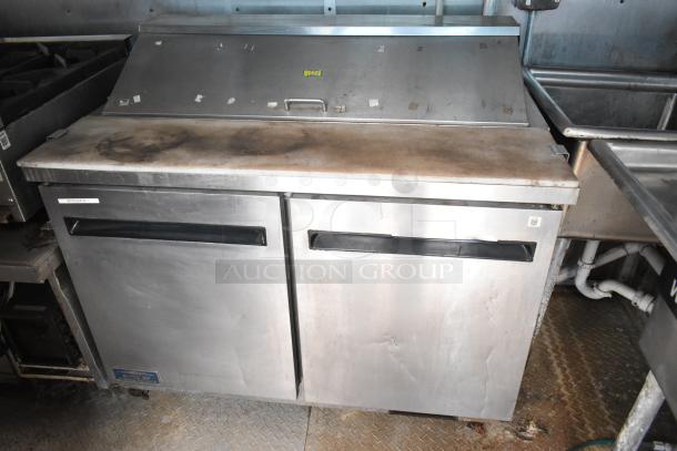 2019 Cruising Kitchens food trailer interior with Arctic Air prep table, showing wear. Steel construction, integrated fire system.