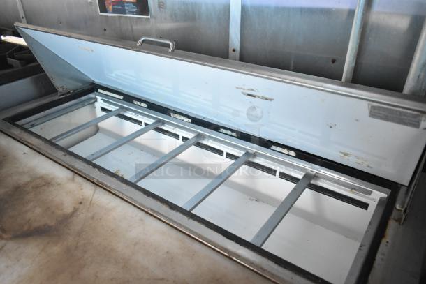 2019 Cruising Kitchens trailer interior with open Arctic Air cooler. Features industrial design and stainless steel surfaces.